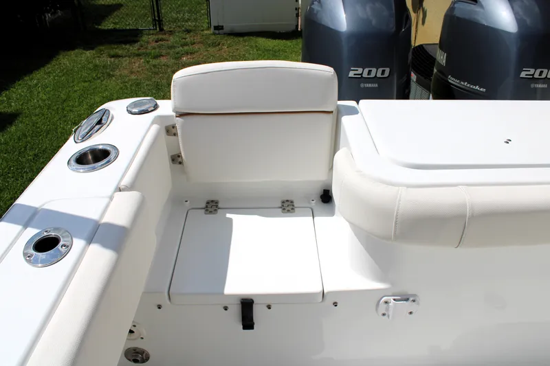 Slide: The Image of 2022 Sea Hunt Gamefish 27 boat interior with seating and twin 200 horsepower engines. - 23