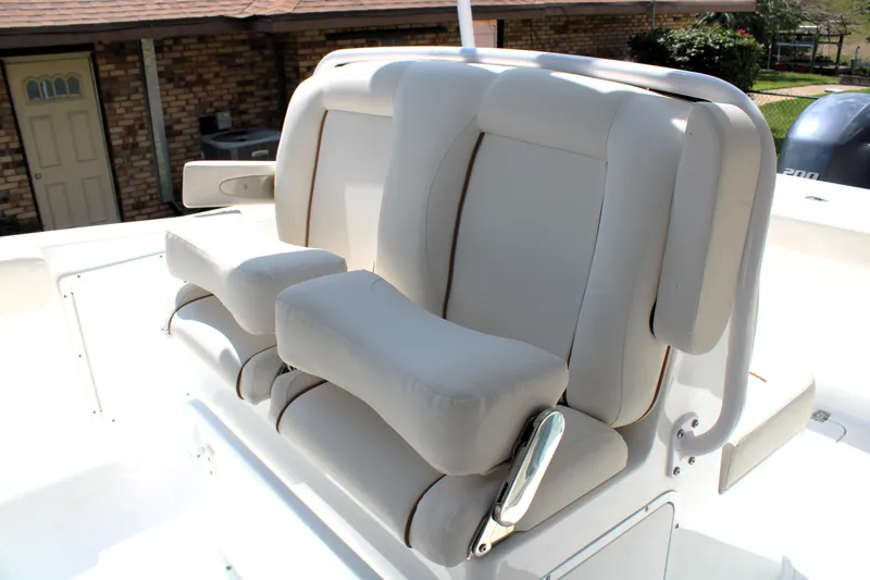 Slide: The Image of 2022 Sea Hunt Gamefish 27 boat seating with cushioned armrests and backrests. - 25