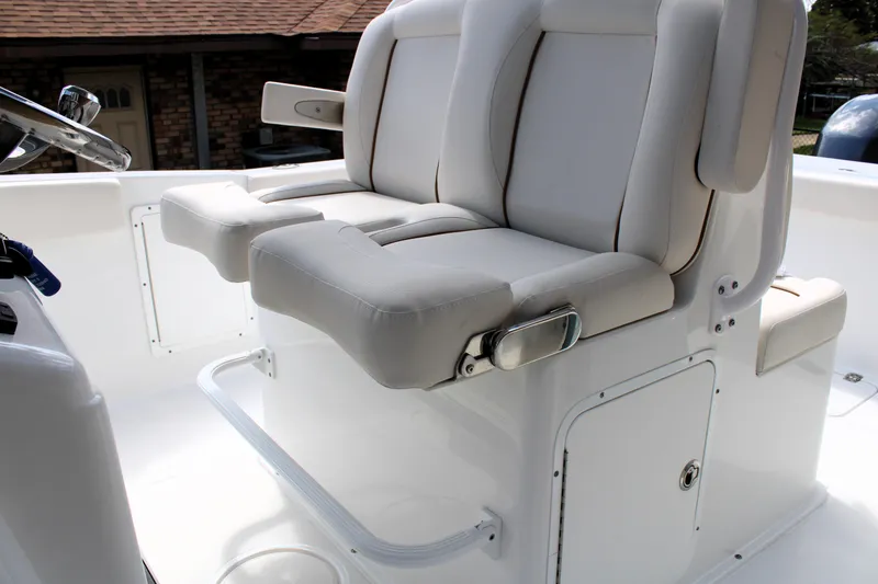 Slide: The Image of 2022 Sea Hunt Gamefish 27 boat seats with white upholstery and armrests. - 26