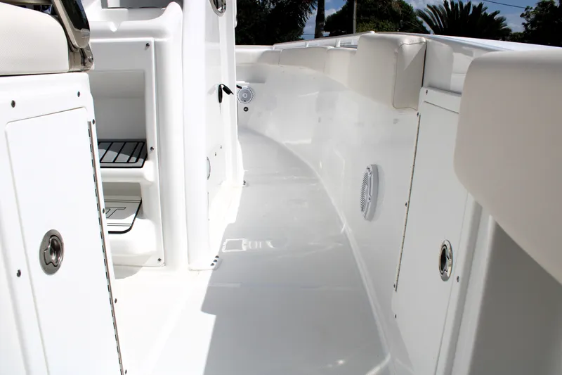 Slide: The Image of 2022 Sea Hunt Gamefish 27 boat interior with coffin box, showcasing sleek white design. - 28