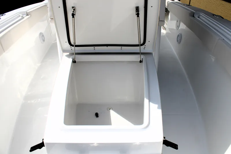 Slide: The Image of 2022 Sea Hunt Gamefish 27 with open coffin box, showcasing spacious storage. - 35