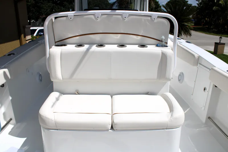 Slide: The Image of 2022 Sea Hunt Gamefish 27 boat with white cushioned seating and coffin box. - 5