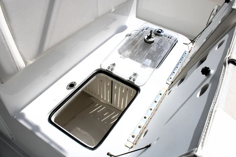Slide: The Image of 2022 Sea Hunt Gamefish 27 Coffin Box interior, open lid, white finish. - 6