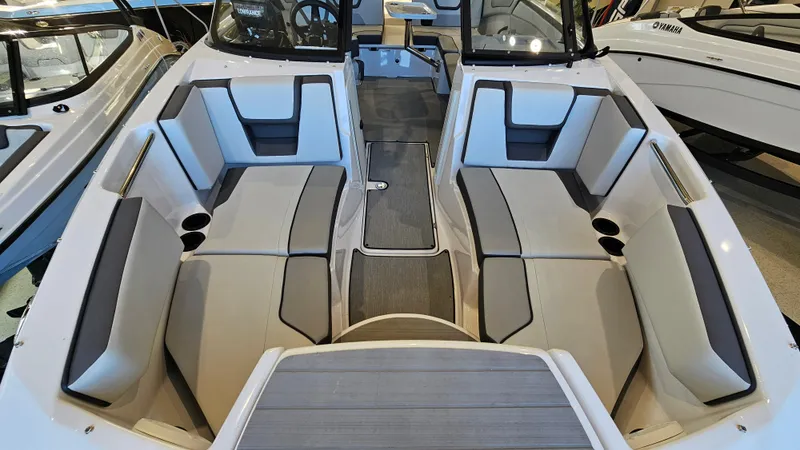Slide: The Image of 2023 Yamaha Boats AR220 interior with spacious seating and modern design. - 18