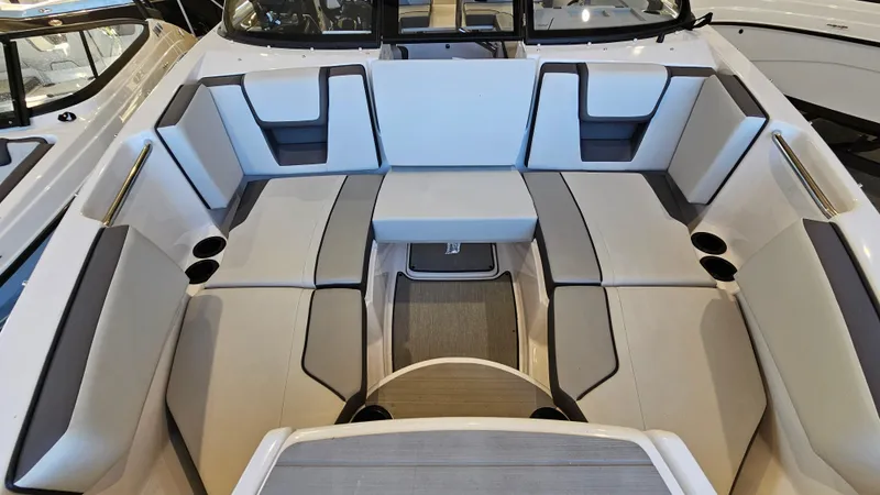 Slide: The Image of 2023 Yamaha Boats AR220 interior with spacious seating and modern design. - 20