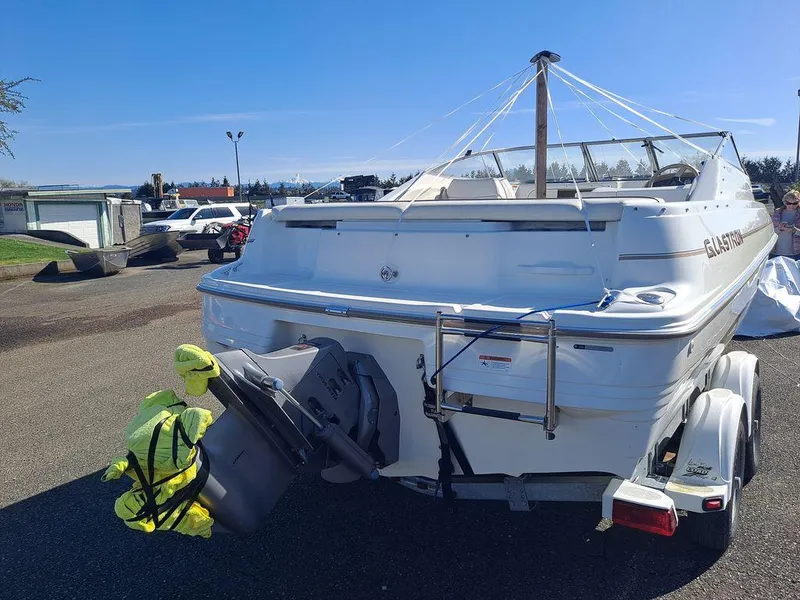 Slide: The Image of 2004 Glastron GS209 boat on trailer, rear view, parked outdoors. - 6
