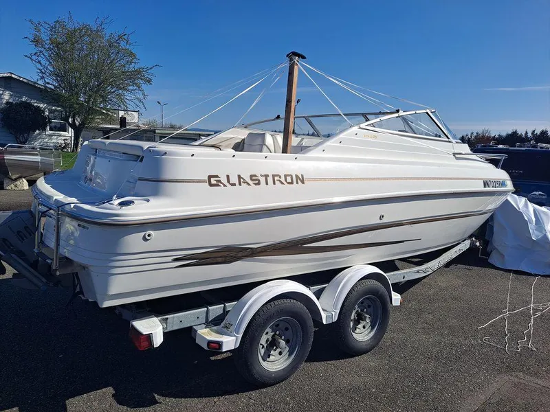 Slide: The Image of 2004 Glastron GS209 boat on trailer, white exterior, parked outdoors. - 7