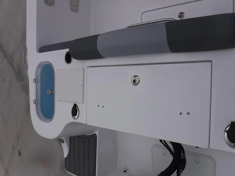 Slide: The Image of 2025 NauticStar 292 Legacy boat interior with seating and storage compartments. - 7