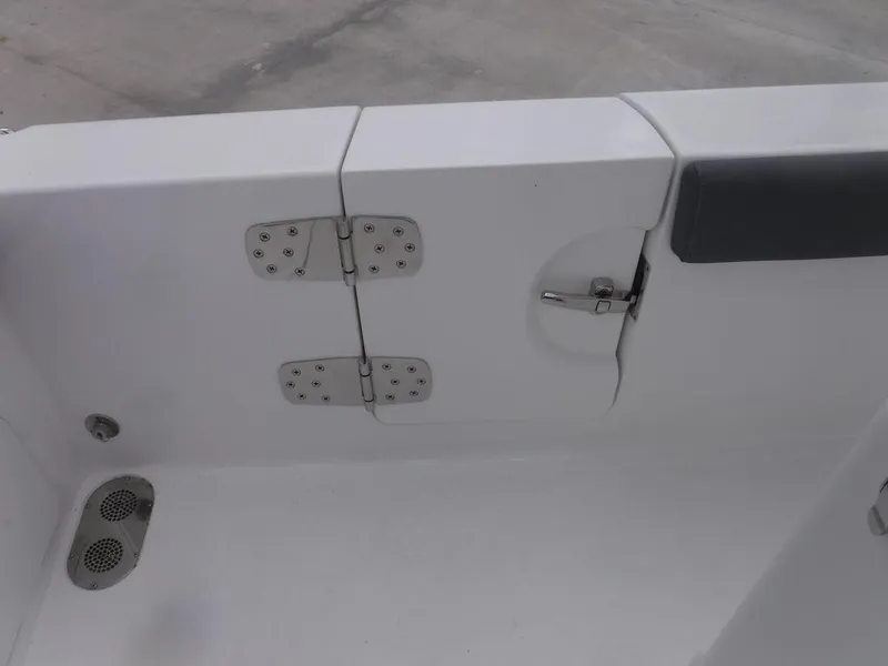 Slide: The Image of 2025 NauticStar 292 Legacy boat interior, featuring stainless steel hinges and latch. - 9