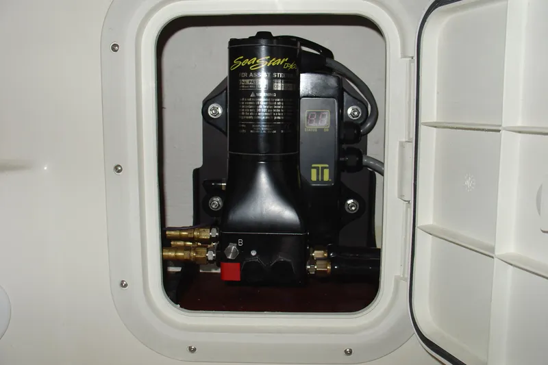 Slide: The Image of 2008 C-Dory 255 TOMCAT engine compartment with SeaStar hydraulic steering system. - 12