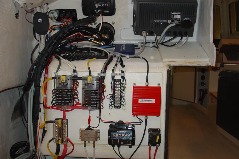 Slide: The Image of Electrical panel of a 2008 C-Dory 255 TOMCAT boat with wiring and components. - 25