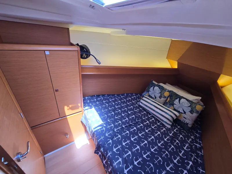 Slide: The Image of Cozy cabin interior of 2017 Jeanneau Sun Odyssey 389 with nautical-themed bedding. - 34
