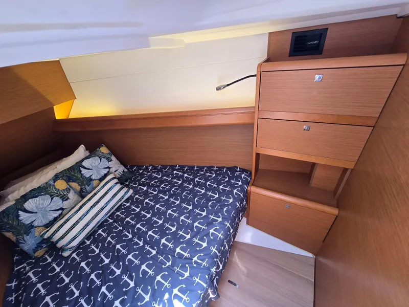 Slide: The Image of Cozy cabin interior of 2017 Jeanneau Sun Odyssey 389 with nautical-themed bedding. - 35
