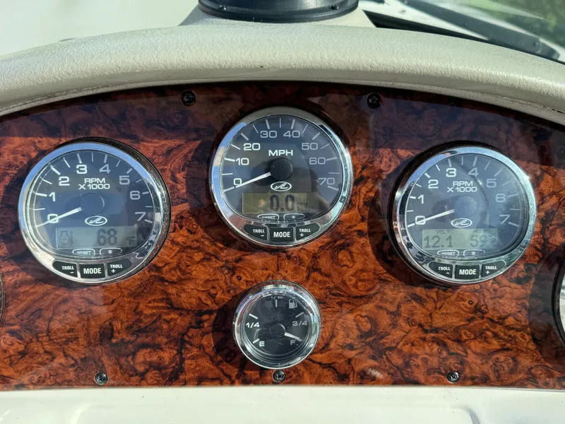 Slide: The Image of Dashboard of a 2006 Sea Ray 290 SLX boat with speedometer and RPM gauges. - 4