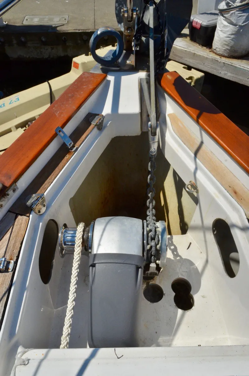 Slide: The Image of Anchor chain and windlass on a 2003 Bavaria 49 sailboat deck. - 29