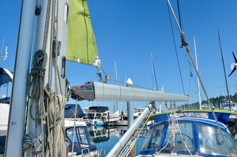 Slide: The Image of Sailboat Bavaria 49, 2003 model, docked at marina with clear blue sky. - 35