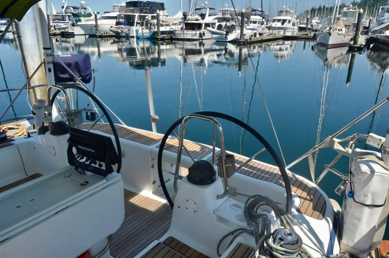 Slide: The Image of Cockpit view of 2003 Bavaria 49 sailboat docked in a marina. - 43