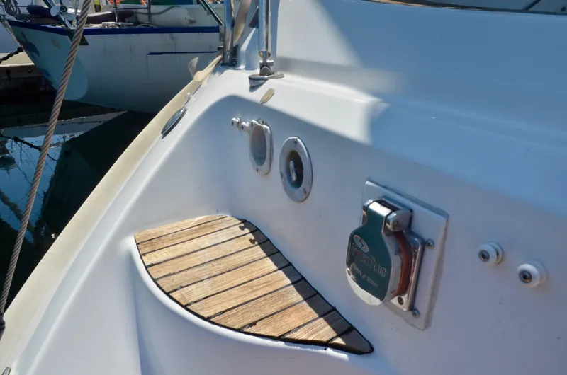 Slide: The Image of 2003 Bavaria 49 yacht deck detail with wooden step and fittings. - 45