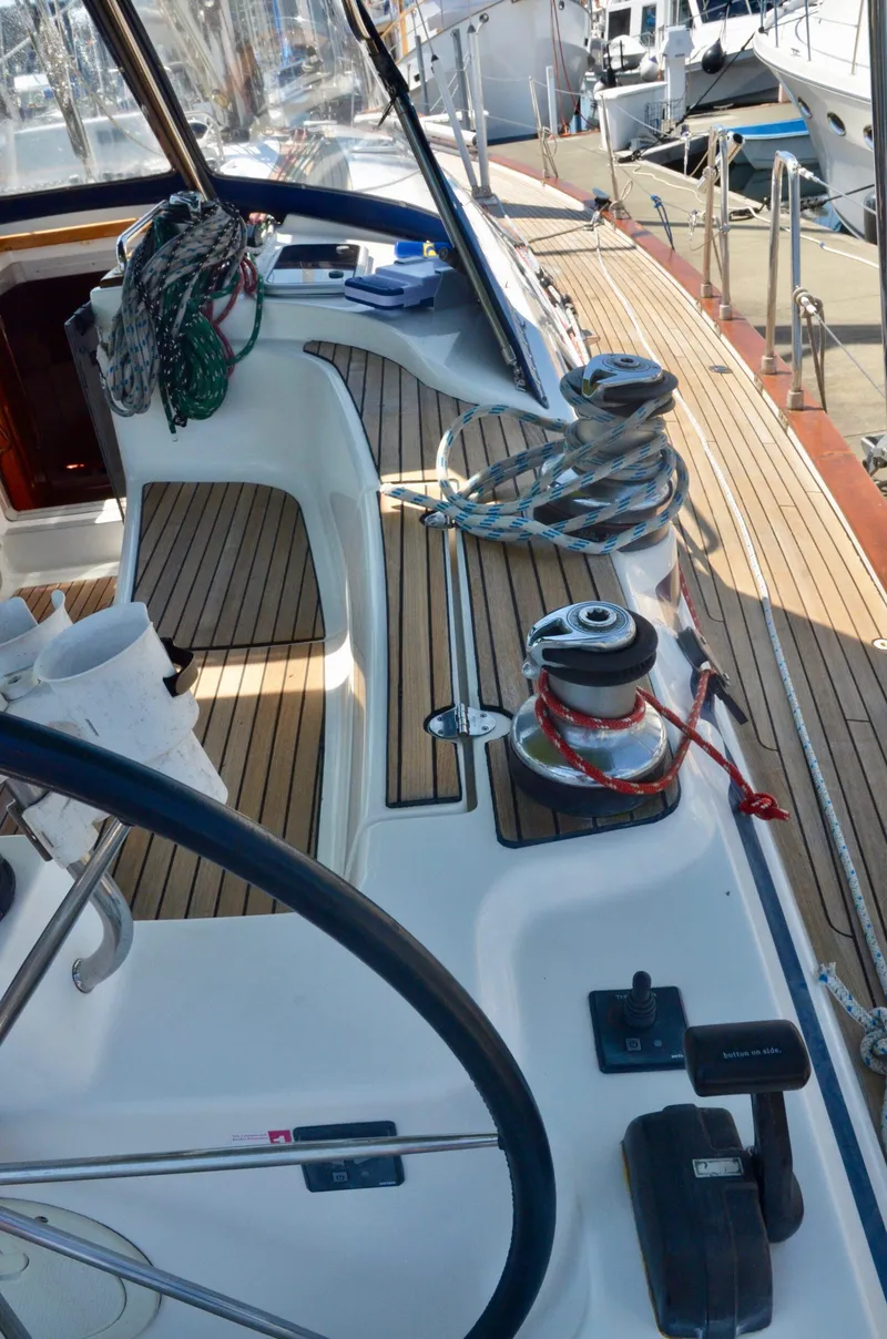 Slide: The Image of 2003 Bavaria 49 yacht deck with ropes and steering wheel. - 47