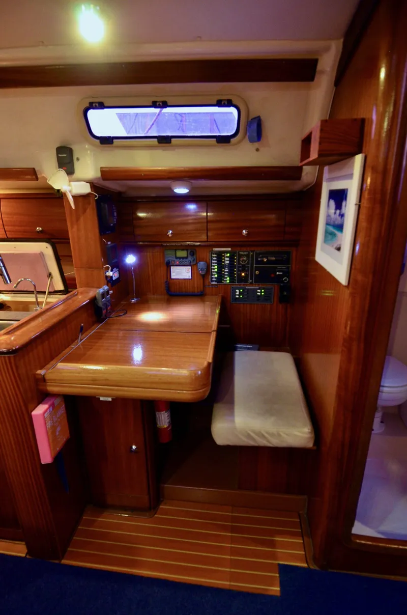 Slide: The Image of Interior of 2003 Bavaria 49 yacht with wooden furnishings and navigation station. - 8
