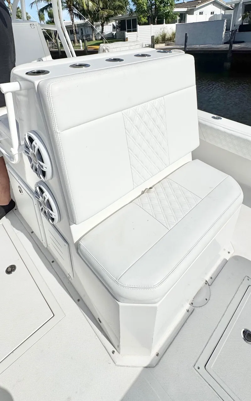 Slide: The Image of White seating on 2021 Ocean Runner 2900 CC boat, featuring diamond-pattern upholstery. - 15