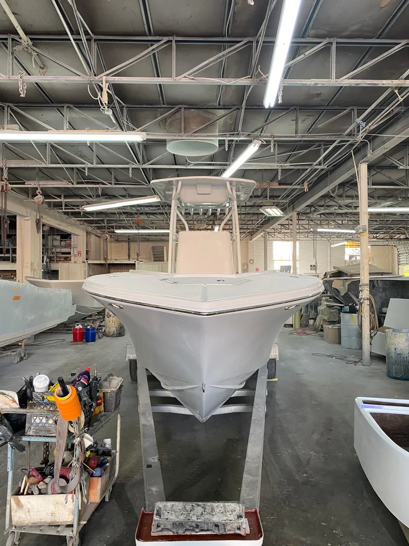 Slide: The Image of 2021 Ocean Runner 2900 CC boat in a workshop, under fluorescent lighting. - 19