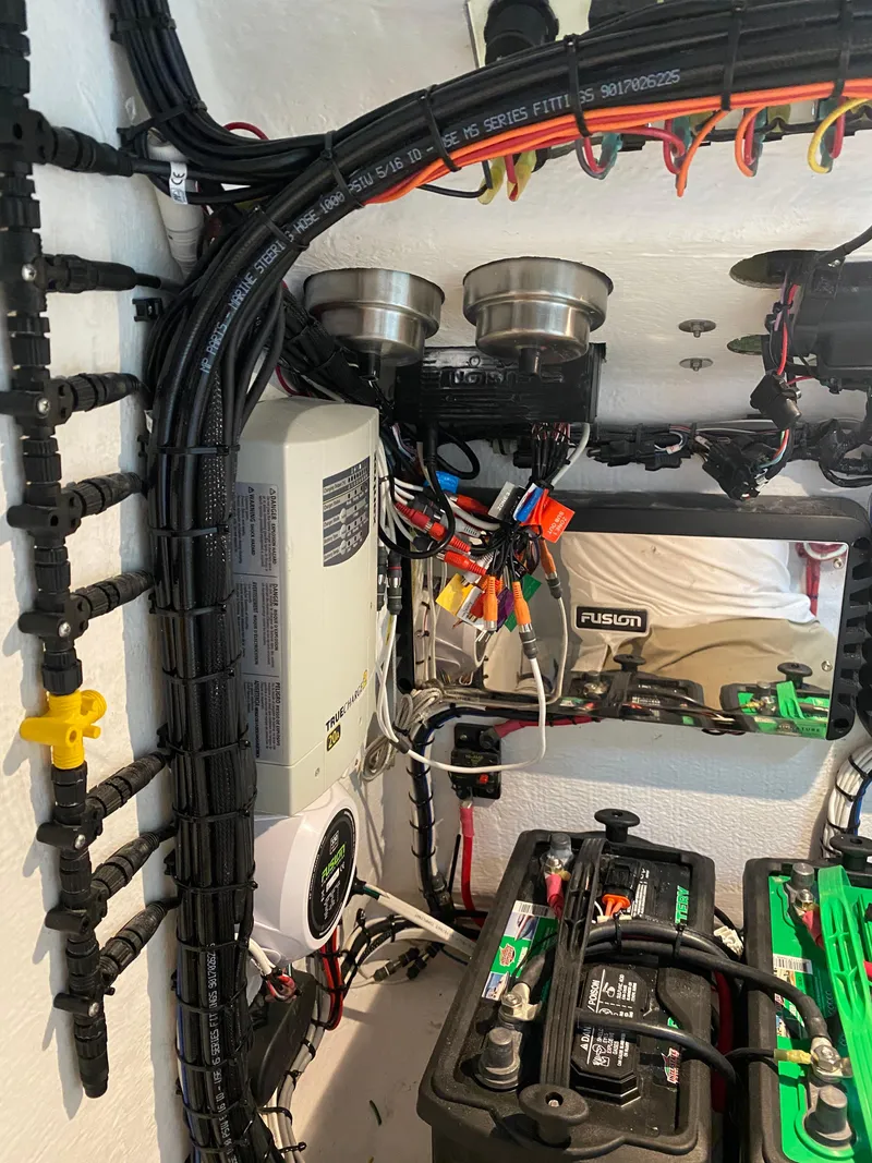 Slide: The Image of Electrical wiring and components inside a 2021 Ocean Runner 2900 CC boat. - 21