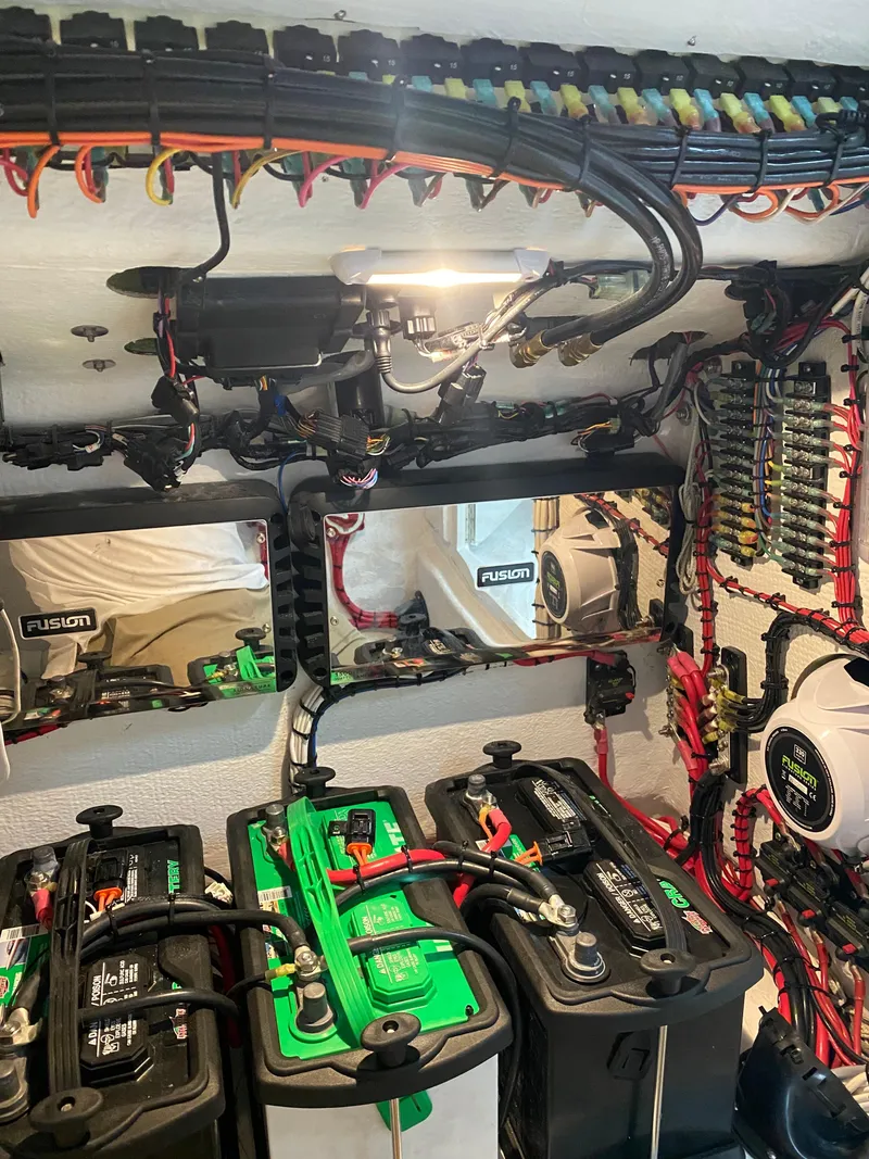 Slide: The Image of 2021 Ocean Runner 2900 CC electrical system with batteries and wiring, showcasing advanced marine technology. - 22