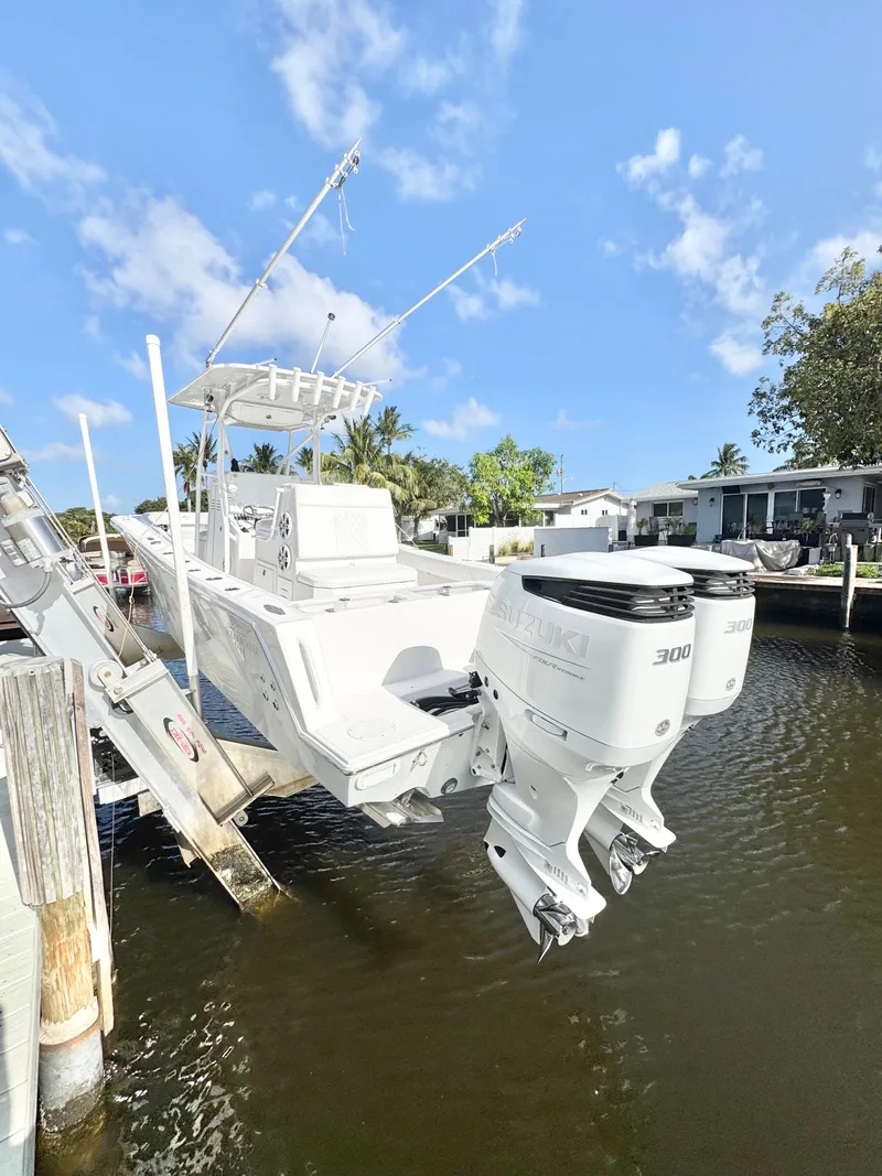 Slide: The Image of 2021 Ocean Runner 2900 CC boat with dual Suzuki 300 engines on a lift. - 3