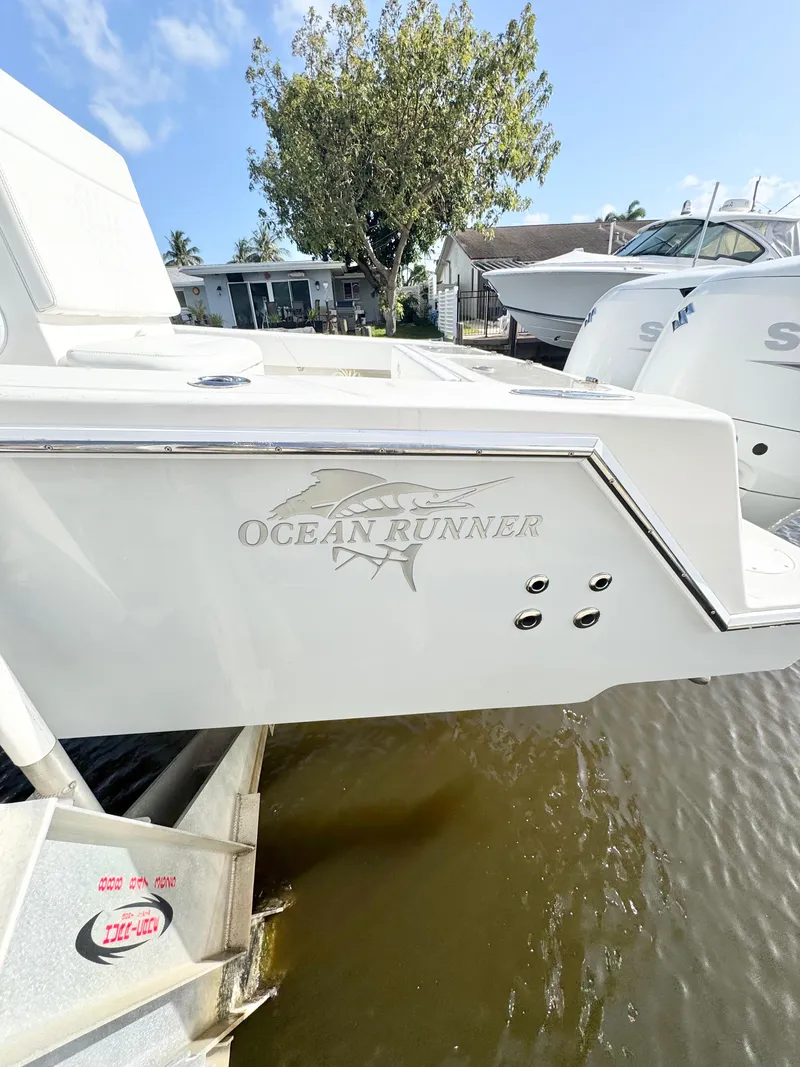 Slide: The Image of 2021 Ocean Runner 2900 CC boat docked near waterfront home. - 7