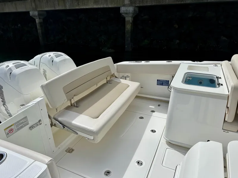 Slide: The Image of 2016 Boston Whaler 320 Vantage boat interior with seating and storage compartments. - 10