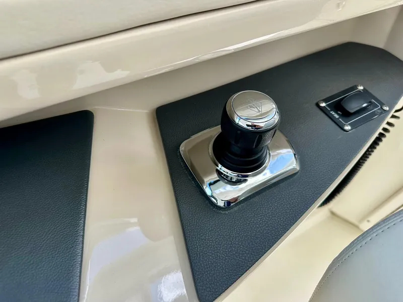 Slide: The Image of Control panel of a 2016 Boston Whaler 320 Vantage boat, featuring a joystick. - 21