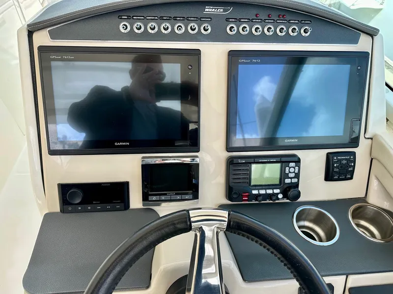 Slide: The Image of Control panel of 2016 Boston Whaler 320 Vantage with dual Garmin displays. - 22