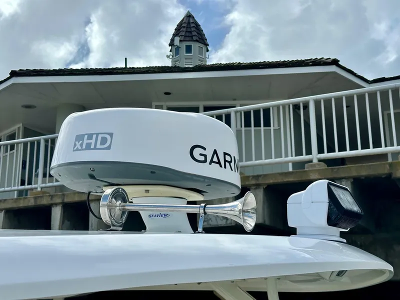 Slide: The Image of Radar and horn on 2016 Boston Whaler 320 Vantage boat, with building in background. - 25
