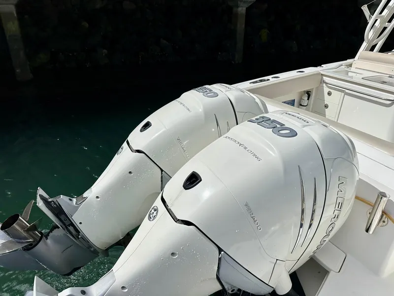 Slide: The Image of Twin Mercury outboard engines on a 2016 Boston Whaler 320 Vantage boat. - 7