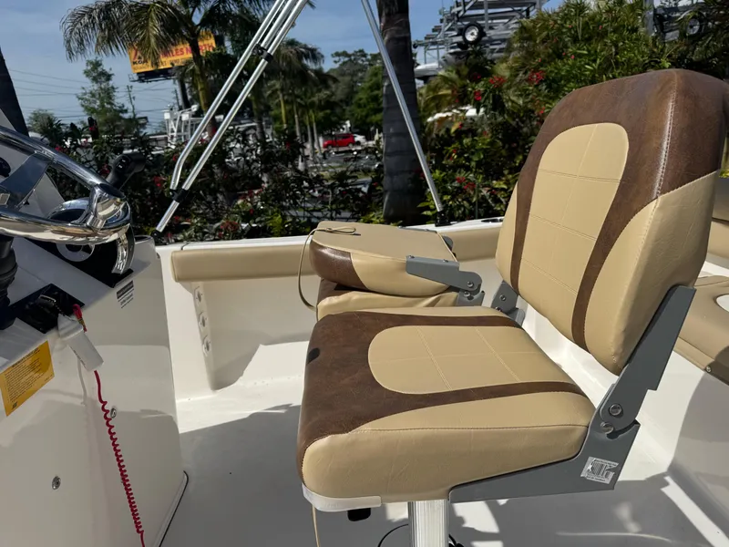 Slide: The Image of 2019 Key West 189 FS boat interior with tan and brown seating. - 21