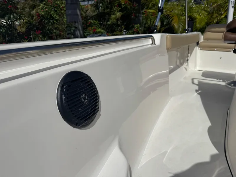 Slide: The Image of 2019 Key West 189 FS boat interior with speaker, white deck, and seating. - 34