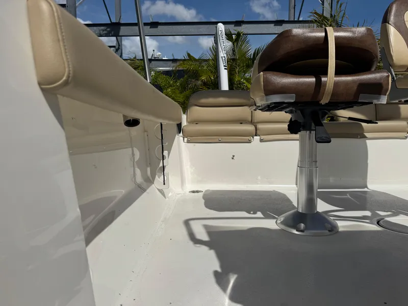 Slide: The Image of 2019 Key West 189 FS boat interior with seating and clear sky background. - 35