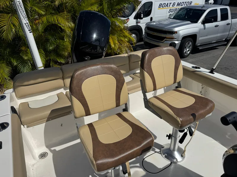Slide: The Image of 2019 Key West 189 FS boat interior with two brown and beige seats. - 37