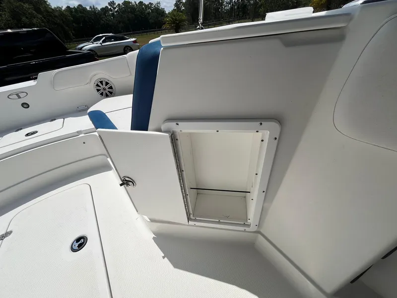 Slide: The Image of 2020 Tahoe 2150 CC boat interior with open storage compartment. - 10