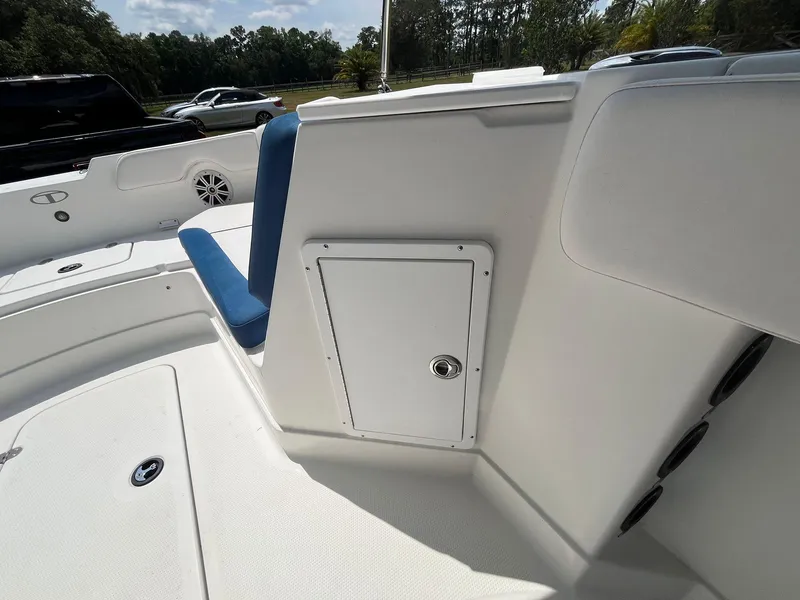 Slide: The Image of 2020 Tahoe 2150 CC boat interior with storage compartment and seating. - 11