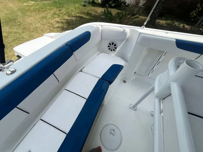 Slide: The Image of 2020 Tahoe 2150 CC boat interior with blue and white seating. - 19