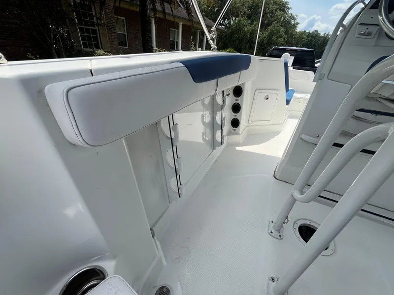 Slide: The Image of 2020 Tahoe 2150 CC boat interior with white seating and storage compartments. - 20