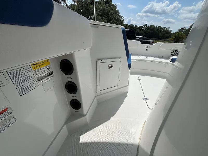 Slide: The Image of 2020 Tahoe 2150 CC boat interior with seating and storage compartments. - 22