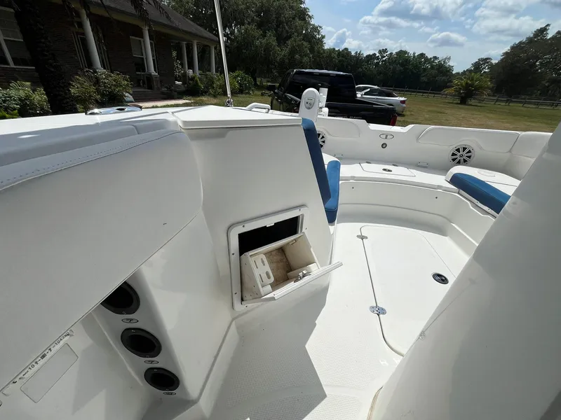 Slide: The Image of 2020 Tahoe 2150 CC boat interior with seating and storage compartments. - 23