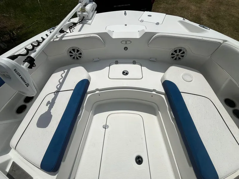 Slide: The Image of 2020 Tahoe 2150 CC boat interior with blue and white seating. - 27
