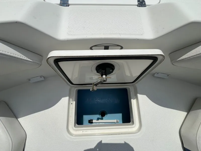 Slide: The Image of 2020 Tahoe 2150 CC boat livewell with open lid and faucet. - 28