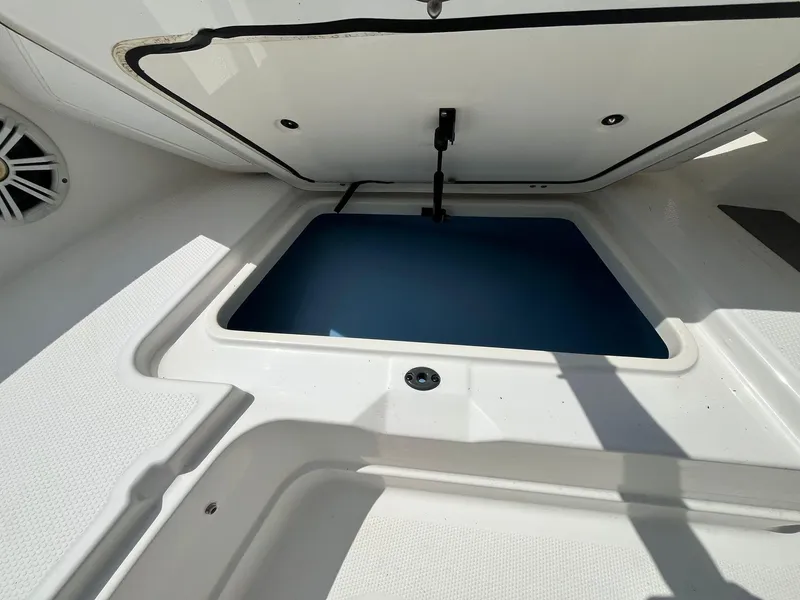 Slide: The Image of Open storage compartment on a 2020 Tahoe 2150 CC boat. - 30