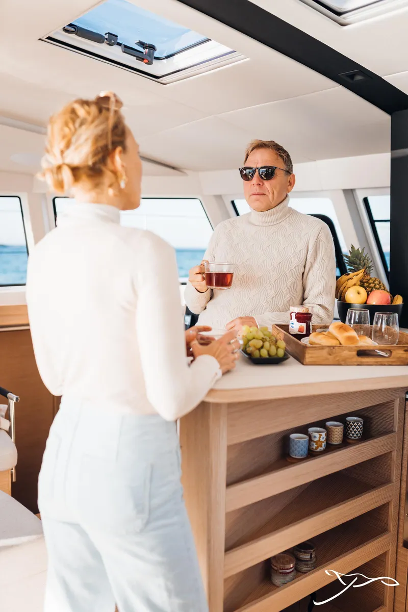 Slide: The Image of Couple enjoying breakfast on Nautitech 44 Open yacht, 2025 model. - 41