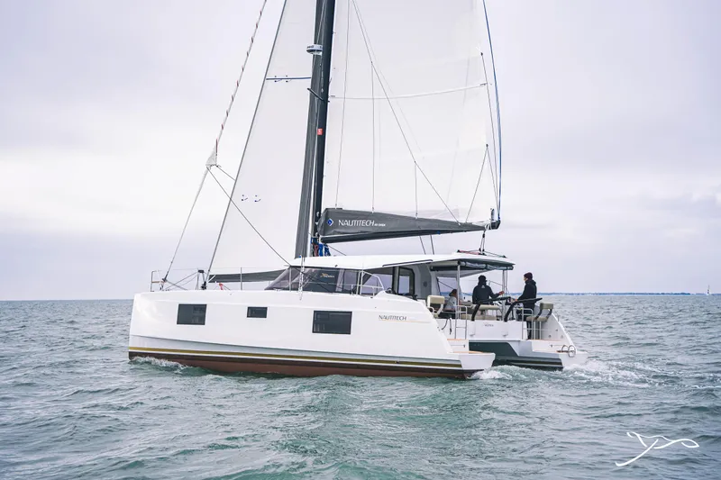 Slide: The Image of 2025 Nautitech 40 Open catamaran sailing on open water. - 3